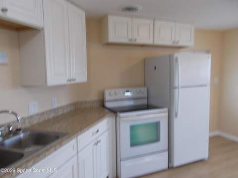 932 Cashew Circle, Barefoot Bay FL - photo 6 of 28