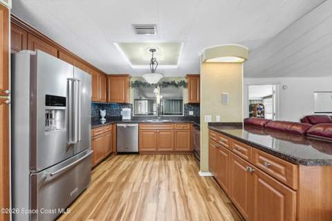 566 Dolphin Circle, Barefoot Bay FL - photo 10 of 37