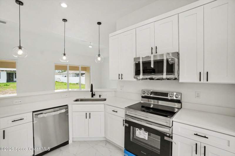 4 bedroom Single Family Residence at 3267 Halacka Avenue, Port Malabar Unit 25, Palm Bay — photo 2