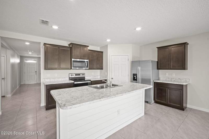 4 bedroom Single Family Residence at 3009 Burrowing Owl Drive, Rymar Greens at Indian River Preserve, Mims — photo 3