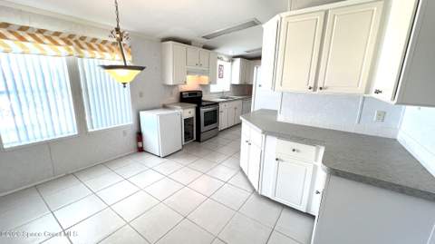 249 Kiwi Drive, Barefoot Bay FL - photo 10 of 39