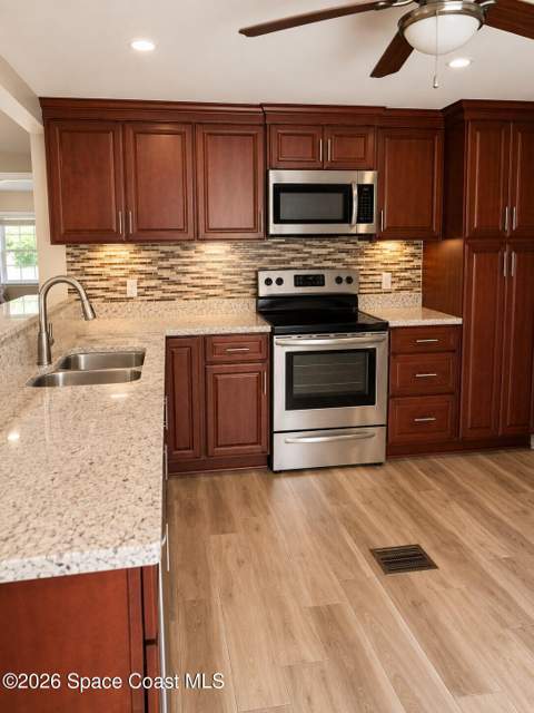 1109 Wren Circle, Barefoot Bay FL - photo 11 of 23