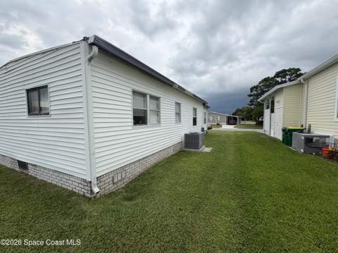 1153 Waterway Drive, Barefoot Bay FL - photo 8 of 59