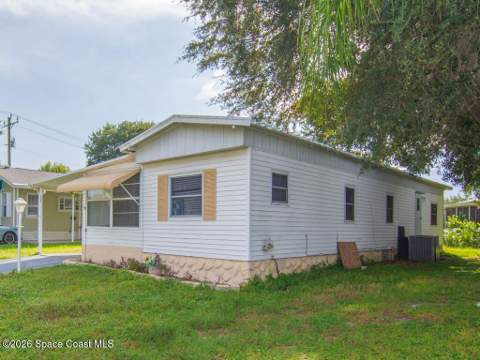 703 Lark Drive, Barefoot Bay FL - photo 7 of 85