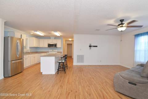 840 Hyacinth Circle, Barefoot Bay FL - photo 9 of 58