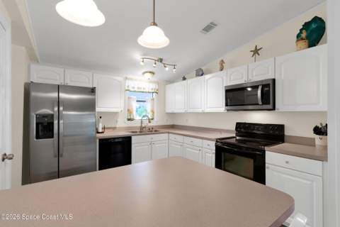 923 Hemlock Street, Barefoot Bay FL - photo 9 of 36