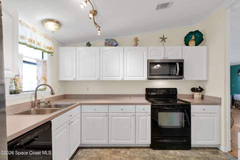 923 Hemlock Street, Barefoot Bay FL - photo 10 of 36