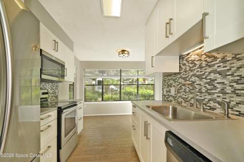 225 S Tropical Trail #302, Merritt Island FL - photo 18 of 38