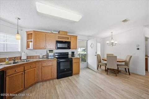 1145 Wren Circle, Barefoot Bay FL - photo 6 of 34