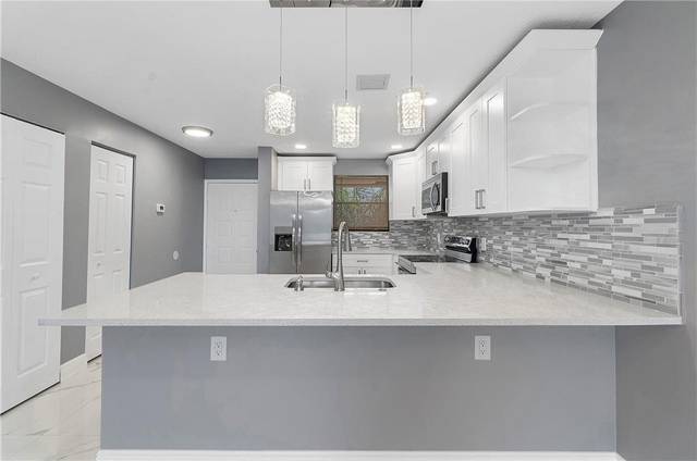 11477 NW 39th Court #305-1