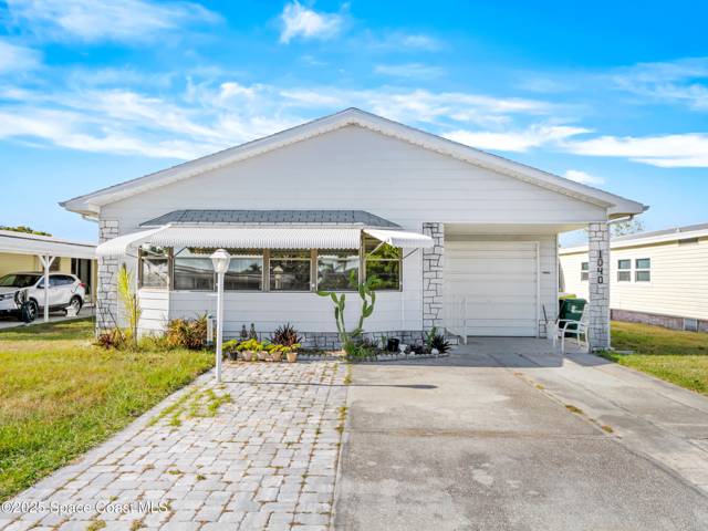 1040 Waterway Drive, home for sale in Barefoot Bay
