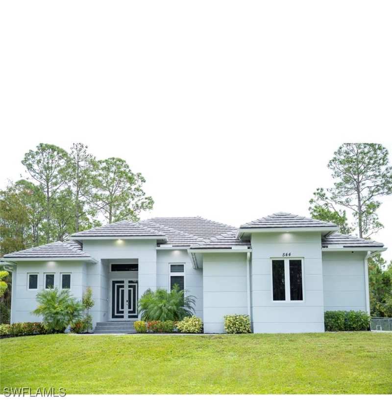 4 bedroom SingleFamilyResidence at 544 31st St SW, Golden Gate Estates, Naples — photo 1
