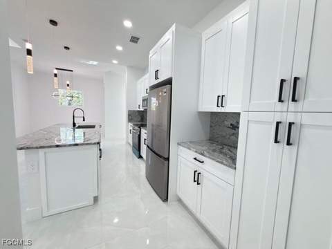 1008 Williams Ave, Lehigh Acres FL - photo 10 of 46