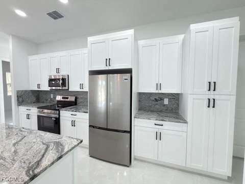 1008 Williams Ave, Lehigh Acres FL - photo 11 of 46
