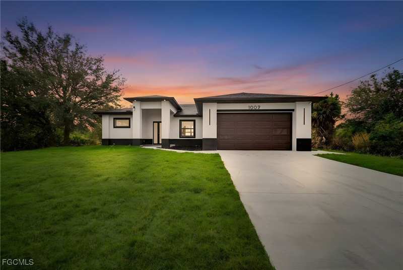 4 bedroom SingleFamilyResidence at 1002 Kanuga St E, Lehigh Acres, Lehigh Acres — photo 1