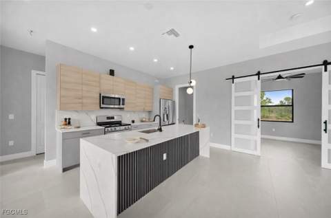 1002 Kanuga St E, Lehigh Acres FL - photo 10 of 49