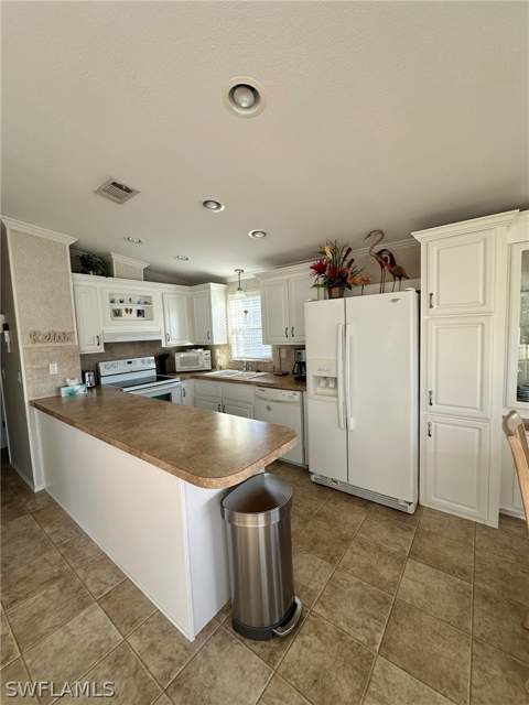 1197 Diamond Lake Cir, Naples FL - photo 11 of 18
