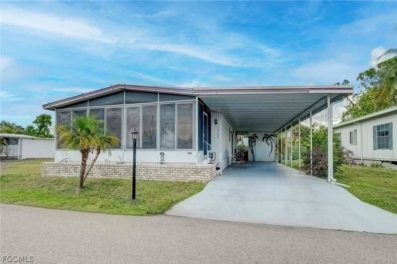 2 bedroom ManufacturedHome at 14597 Paul Revere Loop, Old Bridge Village, North Fort Myers — photo 1