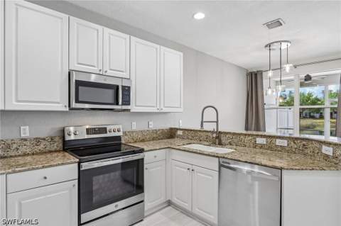 1410 Mariposa Cir 102, Naples FL - photo 9 of 50