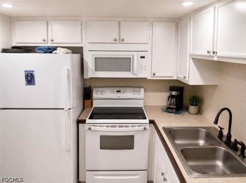 102 E Greens Blvd, Lehigh Acres FL - photo 6 of 33