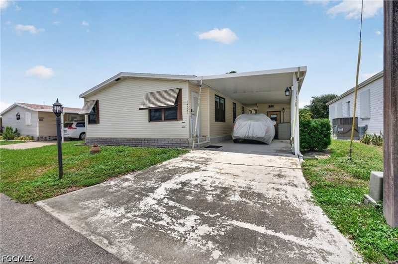 2 bedroom ManufacturedHome at 14527 Paul Revere Loop, Old Bridge Village, North Fort Myers — photo 1