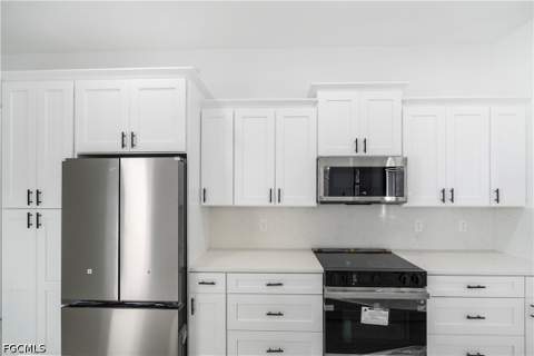 1112 Calvin Ave, Lehigh Acres FL - photo 11 of 44