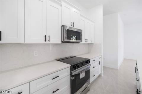 1112 Calvin Ave, Lehigh Acres FL - photo 13 of 44