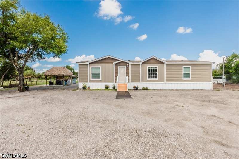 3 bedroom ManufacturedHome at 130 S Nogal St, Montura Ranch Estates, Clewiston — photo 1