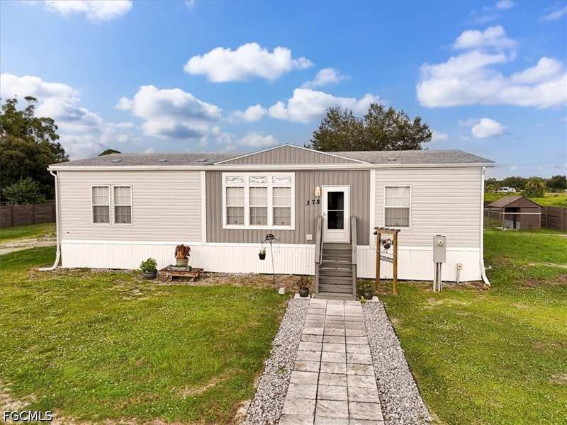 3 bedroom ManufacturedHome at 375 N Estribo St, Montura Ranch Estates, Clewiston — photo 1