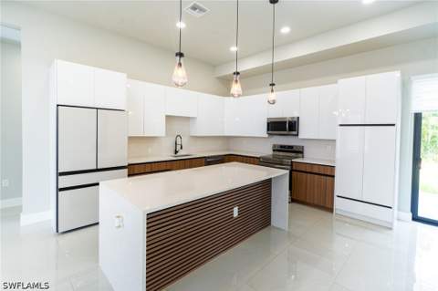 1015 Bagget St E, Lehigh Acres FL - photo 10 of 49