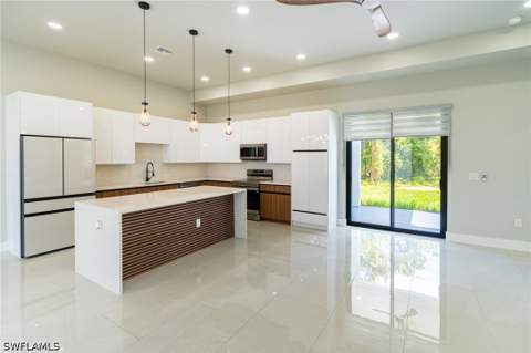 1015 Bagget St E, Lehigh Acres FL - photo 7 of 49