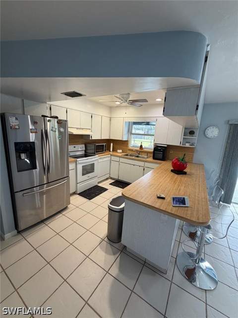 704 Cleveland Ave, Lehigh Acres FL - photo 12 of 48