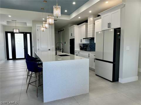 1013 Chaplin Ave, Lehigh Acres FL - photo 6 of 42