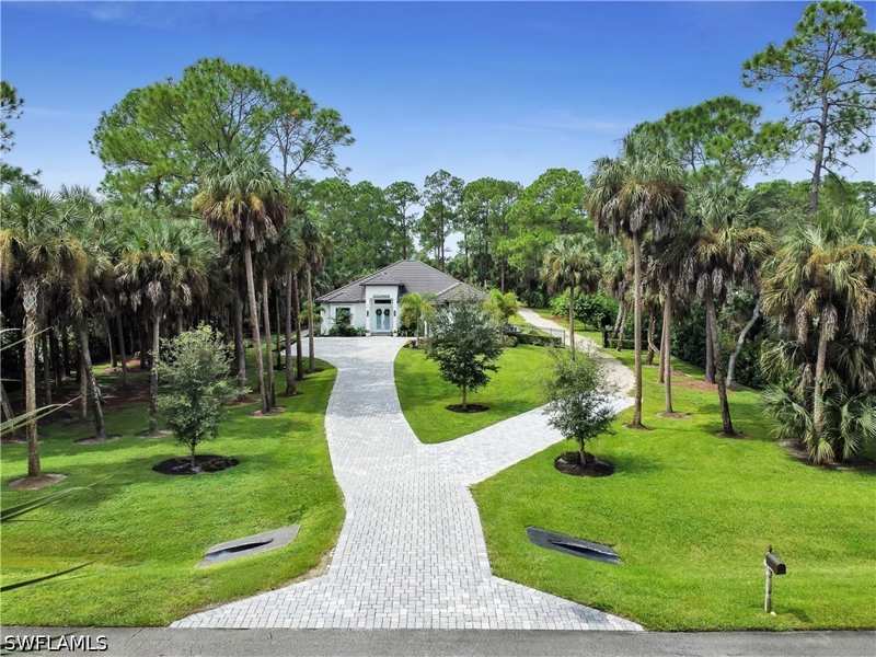 5 bedroom SingleFamilyResidence at 855 1st St NW, Golden Gate Estates, Naples — photo 1