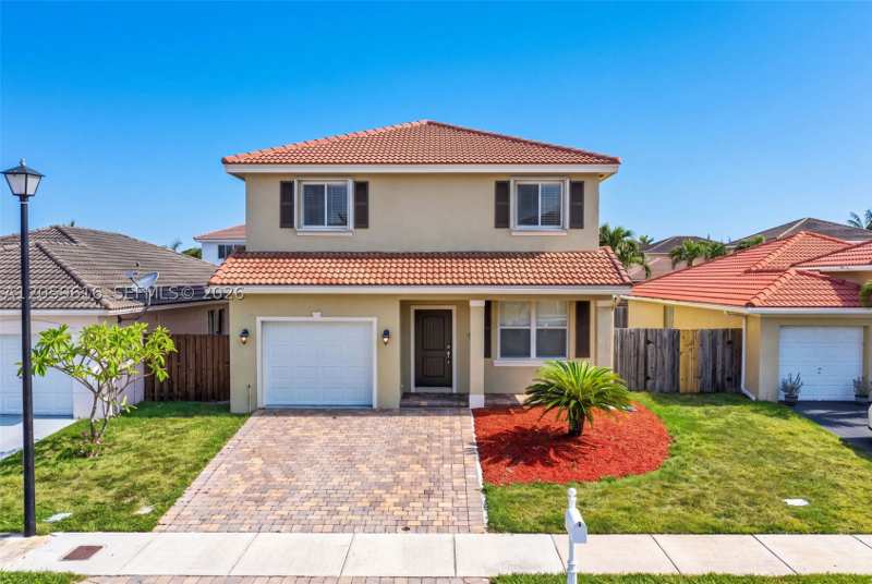 4 bedroom SingleFamilyResidence at 8961 SW 215th Ter, Precious Homes At Lakes B, Cutler Bay — photo 1