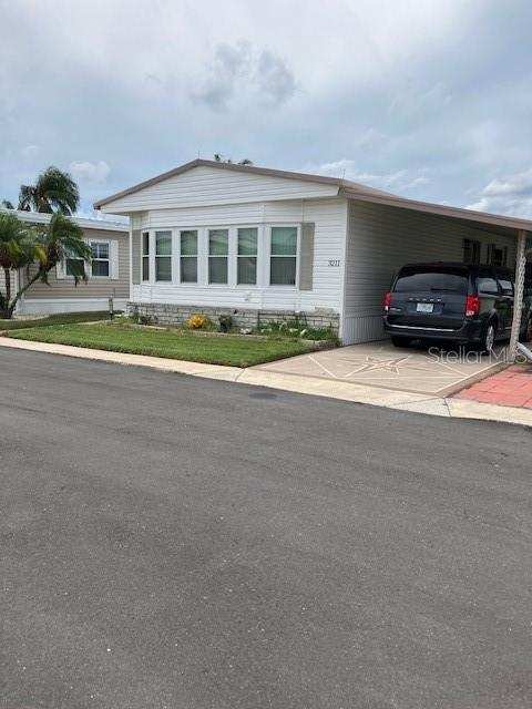 2 bedroom Manufactured Home at 3211 Southport Drive, Tanglewood Mobile Village, Holiday — photo 1