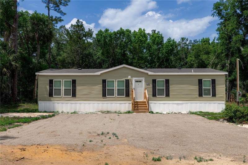 4 bedroom Manufactured Home at 25031 ANTLER STREET, CHRISTMAS PARK FIRST ADD, CHRISTMAS — photo 3