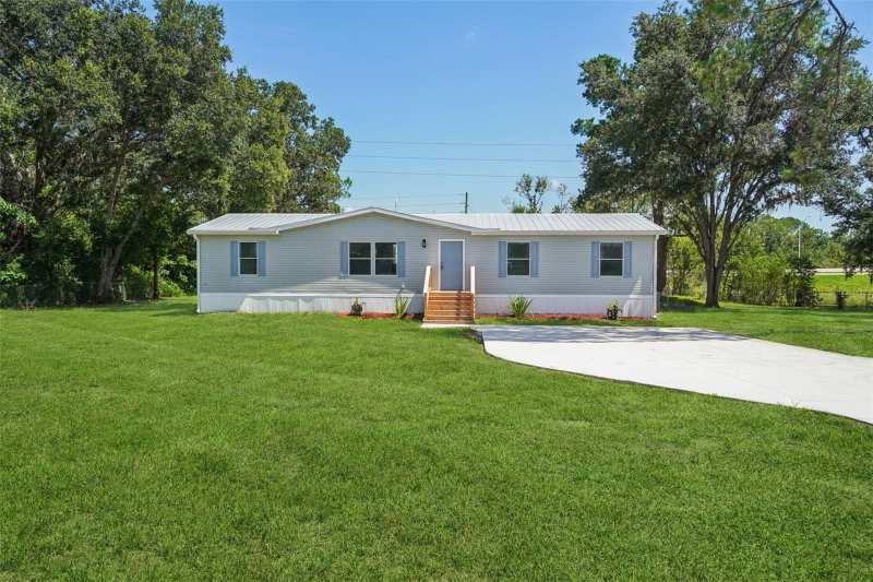 4 bedroom Manufactured Home at 29417 Kelly Drive, Williams Acres No 4 Unrec Plat, Wesley Chapel — photo 1