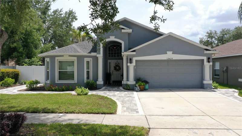 4 bedroom Single Family Residence at 13429 Fladgate Mark Drive, South Fork Unit 10, Riverview — photo 1
