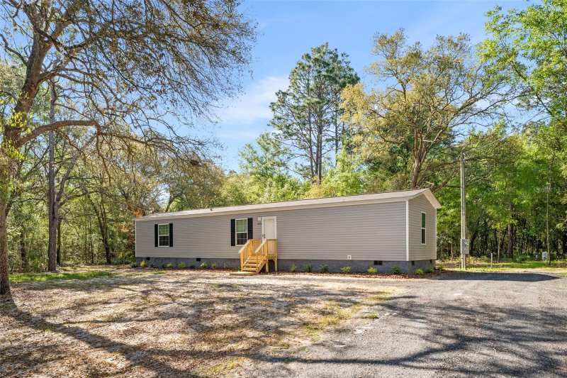3 bedroom Manufactured Home at 10970 NE 71st Street, University Estates, Bronson — photo 1