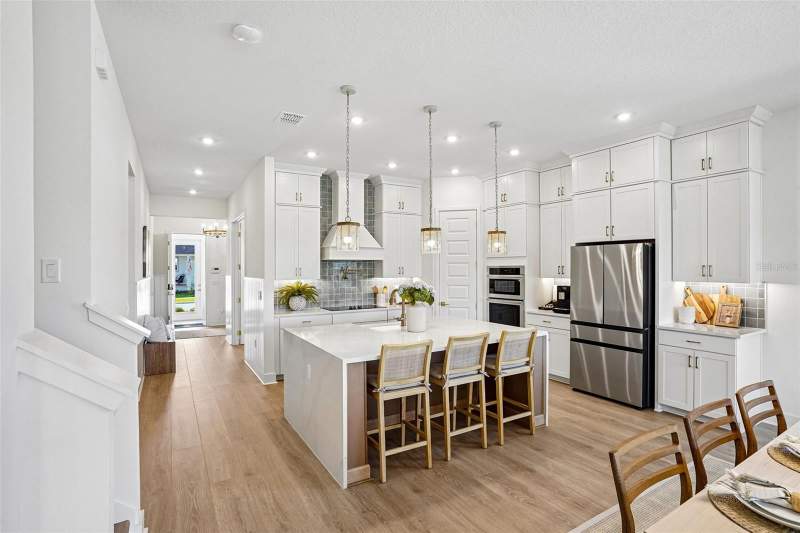5 bedroom Single Family Residence at 17428 Honeybell Tangelo Court, Northlake At Ovation, Winter Garden — photo 4