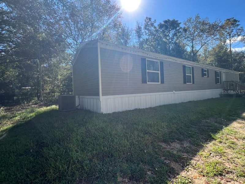 4 bedroom Manufactured Home at 10760 NE 114th Street, University Oaks, Archer — photo 1