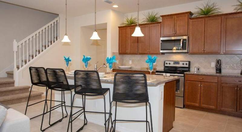 5 bedroom Townhouse at 8879 Geneve Court, Windsor At Westside Ph 2B, Kissimmee — photo 2