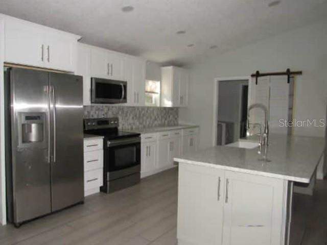 4 bedroom Single Family Residence at 1009 Fort Smith Boulevard, Deltona Lakes Unit 13, Deltona — photo 3
