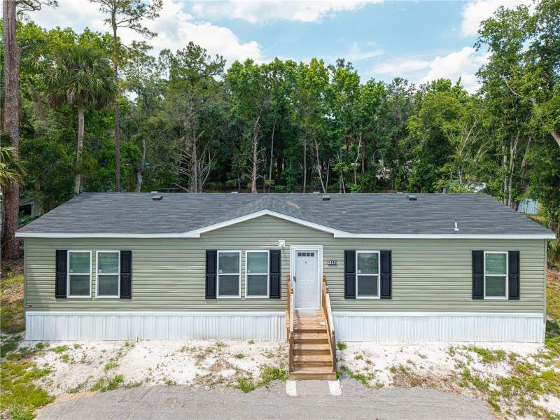 4 bedroom Manufactured Home at 25031 ANTLER STREET, CHRISTMAS PARK FIRST ADD, CHRISTMAS — photo 1
