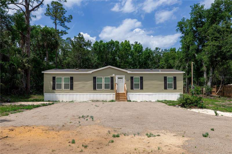 4 bedroom Manufactured Home at 25031 ANTLER STREET, CHRISTMAS PARK FIRST ADD, CHRISTMAS — photo 2
