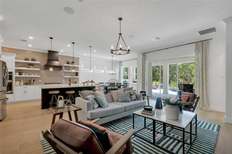 4 bedroom Single Family Residence at 17418 Honeybell Tangelo Court, Northlake At Ovation, Winter Garden — photo 2