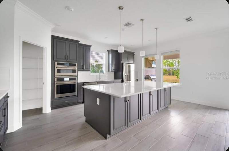 4 bedroom Single Family Residence at 15997 HONEY HARVEST STREET, HARVEST AT OVATION, WINTER GARDEN — photo 4
