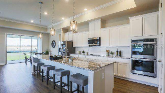 4 bedroom Single Family Residence at 930 BUCKEYE DRIVE, RESERVE AT HAMMOCK OAKS, LADY LAKE — photo 3