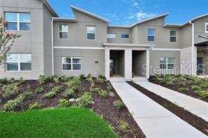 4 bedroom Townhouse at 392 Ocean Course Avenue, Stoneybrook South North Parcel Ph 1 Pb 26 Pgs 147-, Champions Gate — photo 1